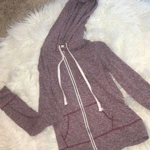 A burgundy women’s sweatshirt.